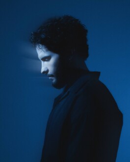 Portrait of a person in blue lighting, used to represent the founder of NEOHM Studio. 